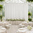 Elegant white wedding reception in a glass greenhouse with floral decor