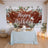 Birthday celebration setup with cake, flowers, and decorations.