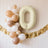 Cream number "0" balloon with beige and white balloons in a festive arrangement.