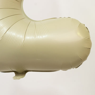 Beige inflatable balloon in the shape of a number.