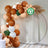 Biodegradable balloon arch with natural accents for eco-friendly events.