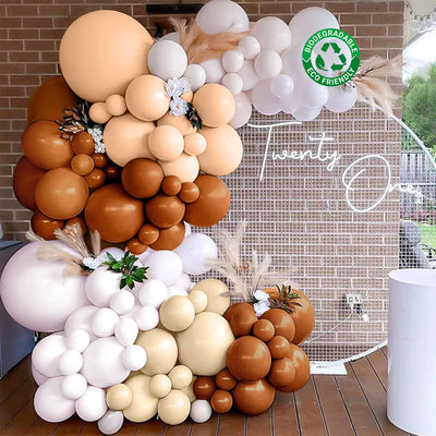 Decorative balloon arch in neutral tones for a celebration event.