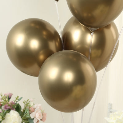 Gold metallic balloons in a cluster.