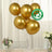 Gold biodegradable balloons arranged in a clear vase with flowers.