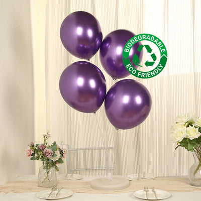 Purple biodegradable balloons with eco-friendly label on a table setting.