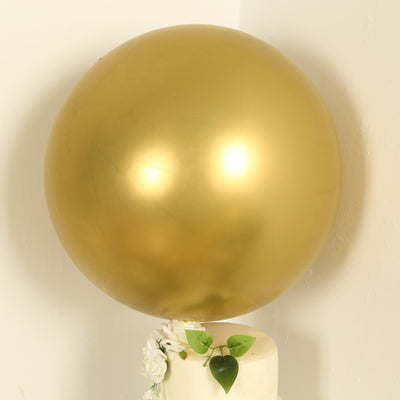 Gold balloon on a cake with decorative flowers and leaves.