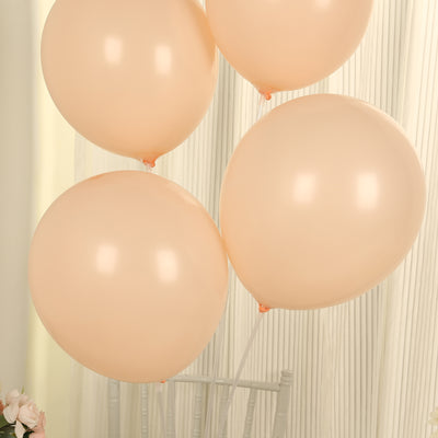 Peach balloons in a cluster against a soft background