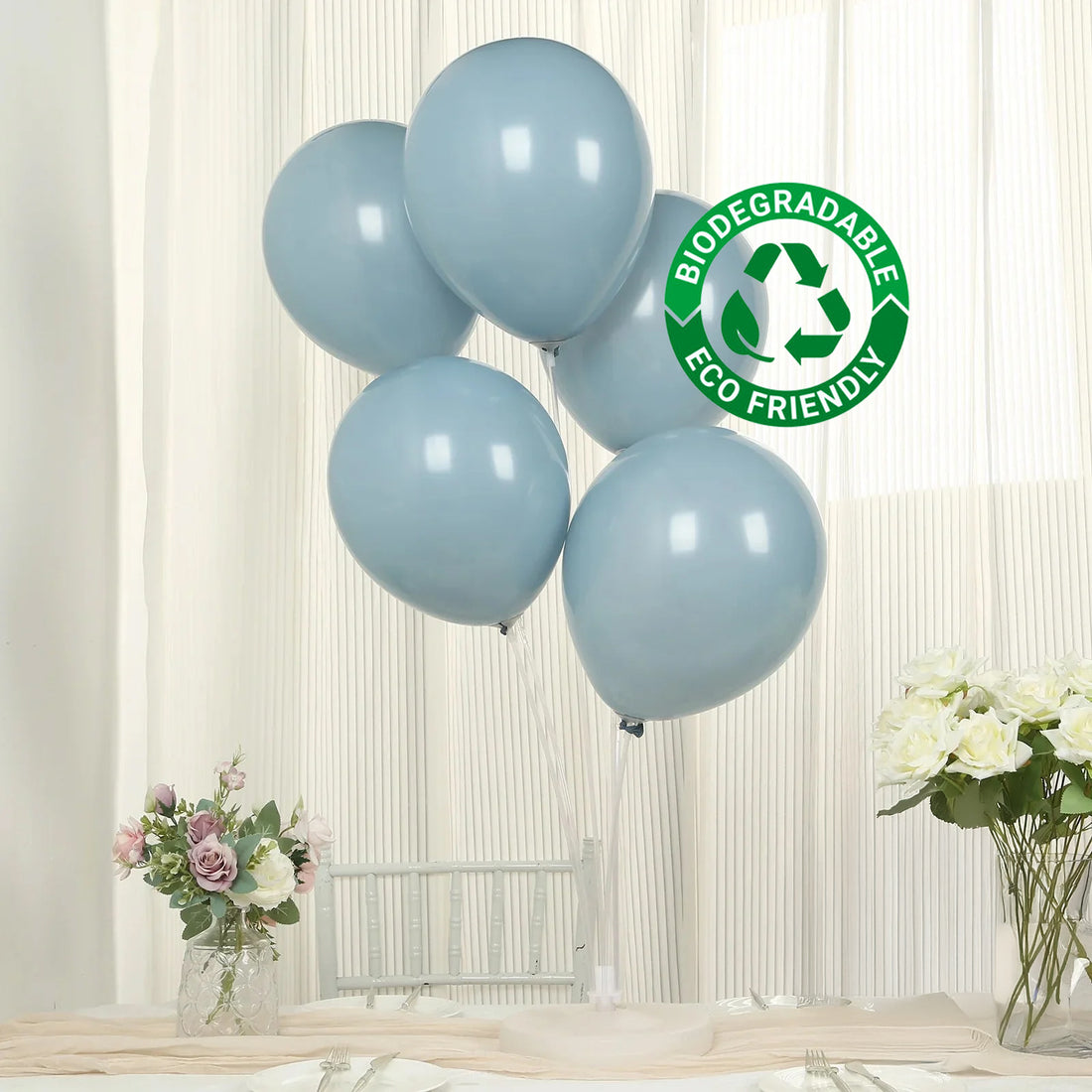 Blue biodegradable balloons in a studio-style shot.