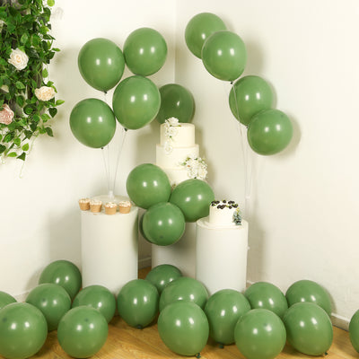 Green balloons with cakes in a festive setting.