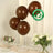 Brown biodegradable eco-friendly balloons on a table with flowers.