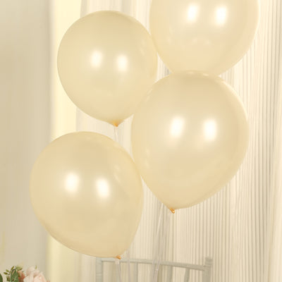 Cream balloons grouped together against a soft background.