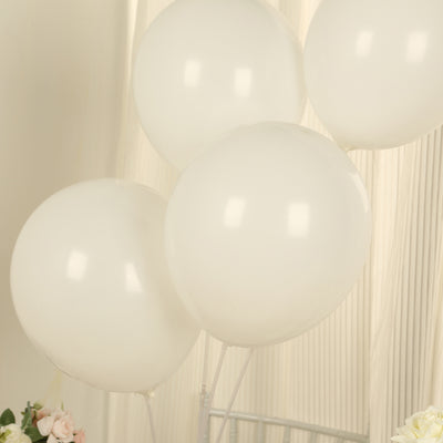 White balloons grouped together against a soft background.