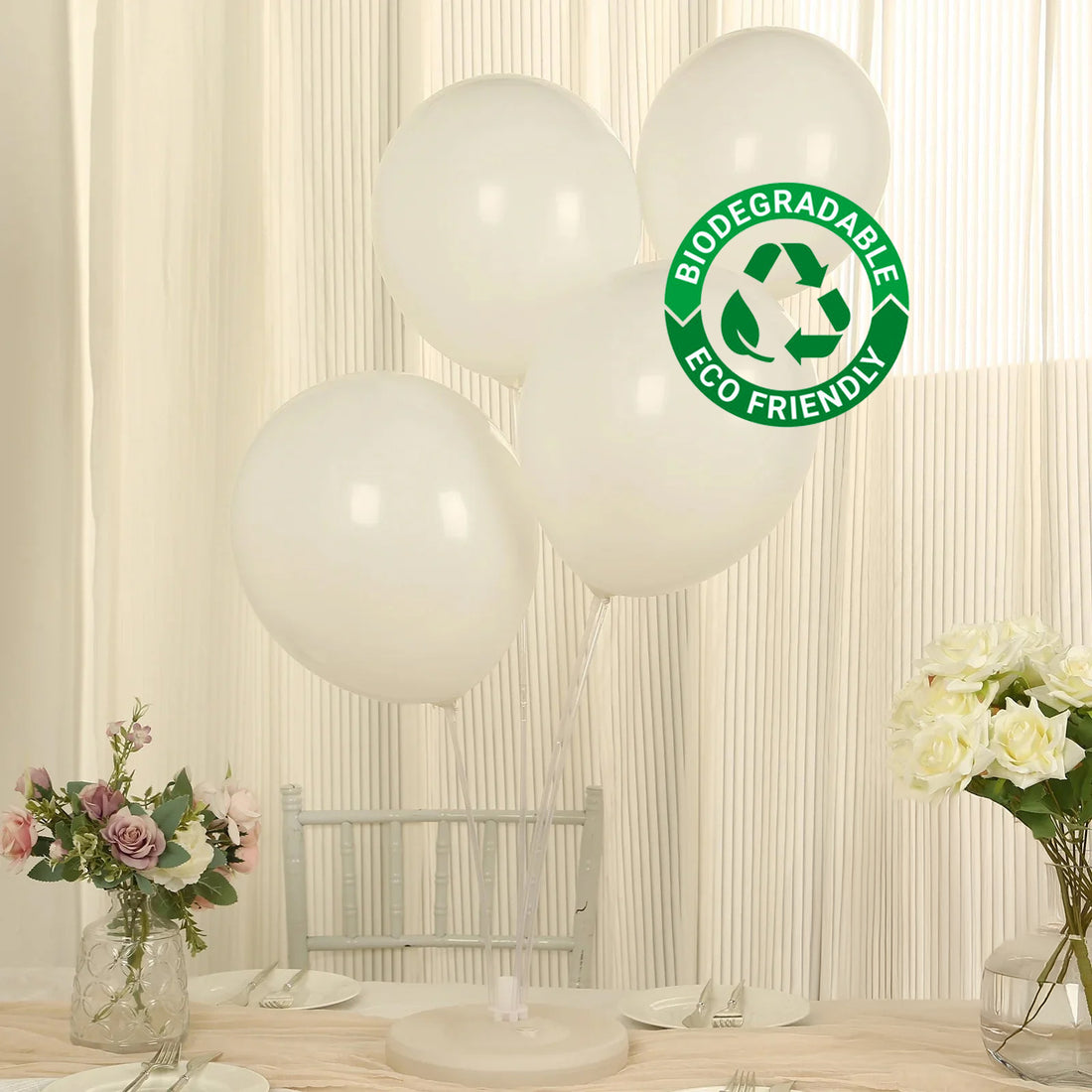 Biodegradable eco-friendly white balloons on a table setting.