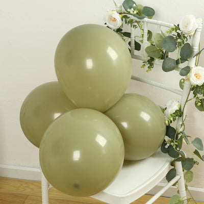 Green balloons arranged on a chair with floral decor.