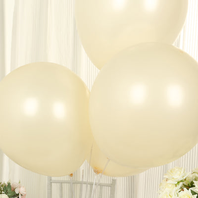 Three elegant beige balloons floating together.