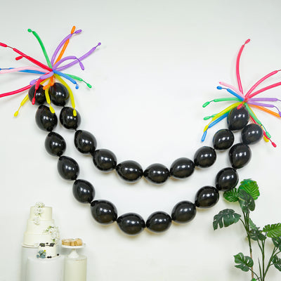 Black balloon garland with colorful accents for festive decor