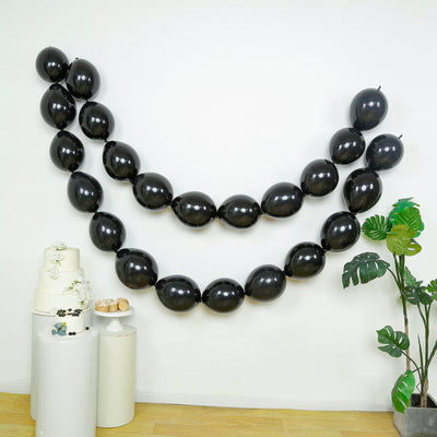 Black balloon garland decoration for parties and events.
