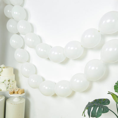 White balloons garland decoration for events and celebrations.