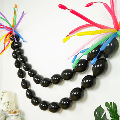 Colorful balloon garland with black balloons and vibrant accents
