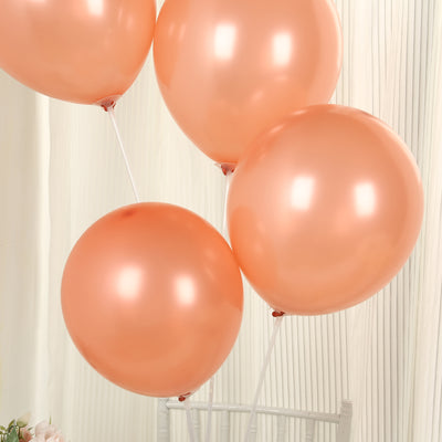 Peach balloons floating elegantly against a soft background.