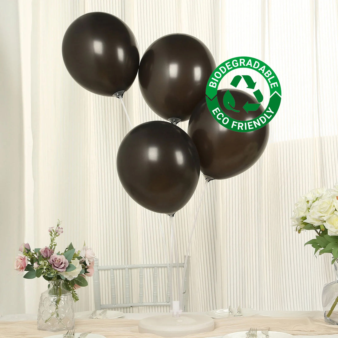 Brown biodegradable balloons on a table with flowers