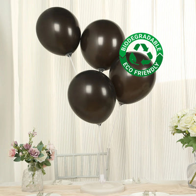 Brown biodegradable balloons on a table with flowers