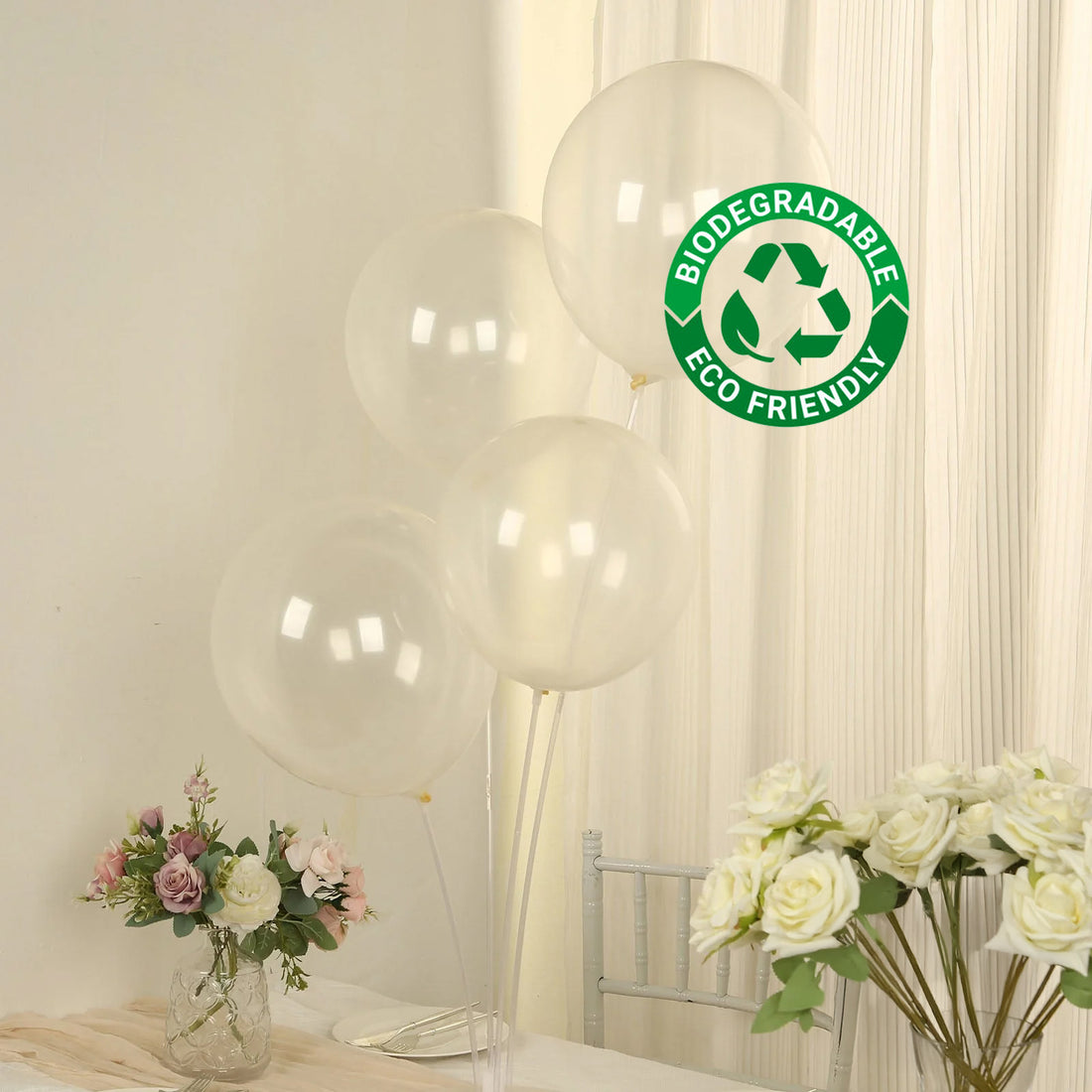 Clear biodegradable balloons with eco-friendly label in a soft setting.