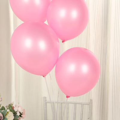 Pink balloons floating elegantly against a soft background.