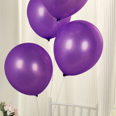 Purple helium balloons tied together for festive celebrations.