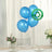 Blue biodegradable balloons on a table with flowers and eco-friendly label.
