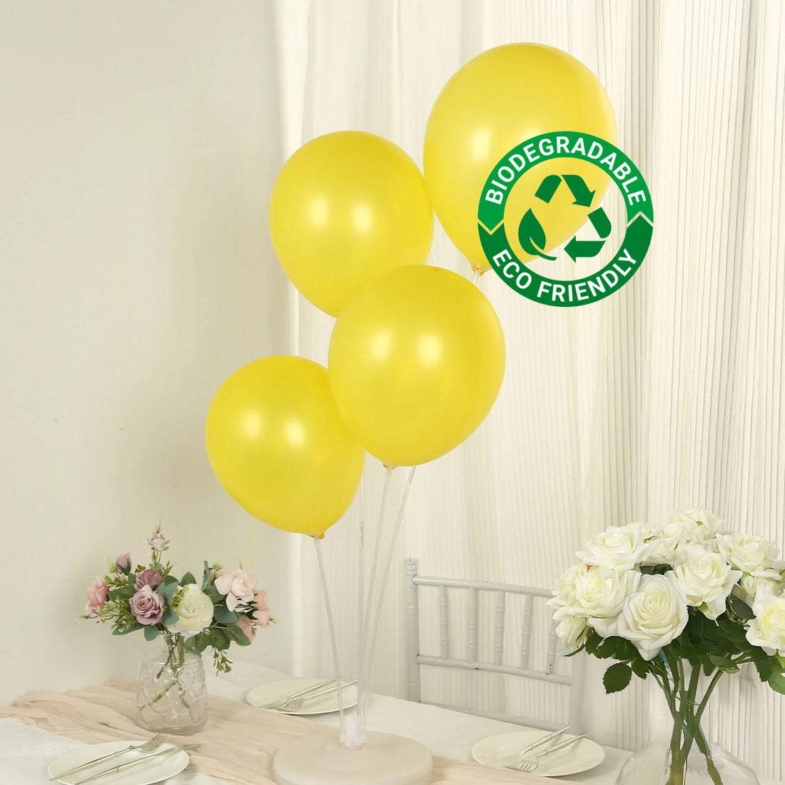 Eco-friendly biodegradable yellow balloons at a table setting.