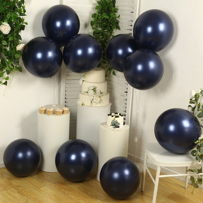Navy blue balloons arranged with decorative elements in a stylish setting.