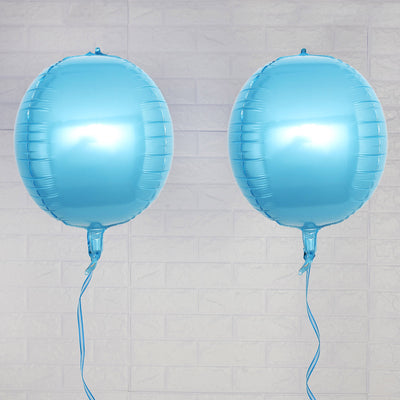 Two shiny blue balloons with ribbons on a plain background.