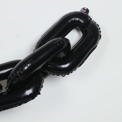 Black inflatable chain link on a plain background
