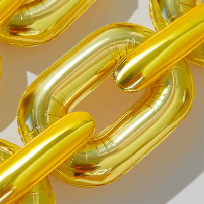 Gold inflatable chain links on a plain white background.