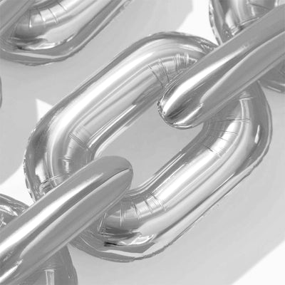 Silver inflatable chain links on a plain background.