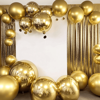 Gold balloons arranged in a festive display against a shimmering backdrop.