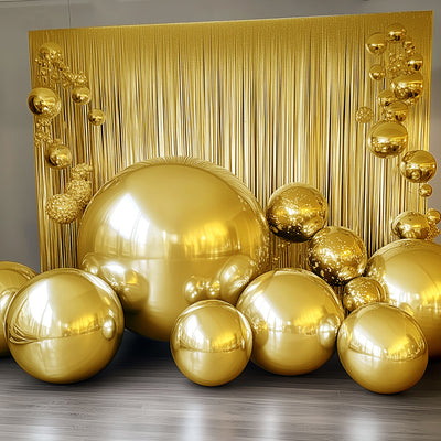 Golden decorative spheres arranged in an artistic display against a shimmering backdrop.