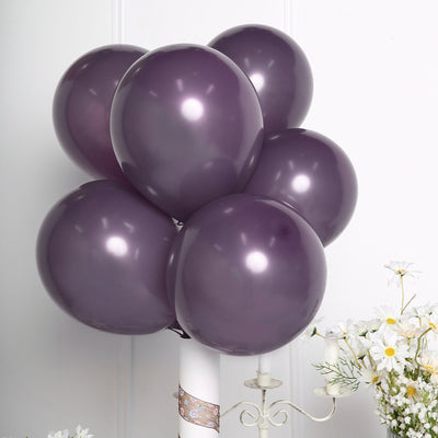 Purple balloons arranged in a cluster on a white background.