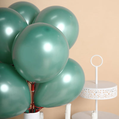 Green metallic balloons in a stylish arrangement on a soft background.