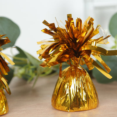 Gold foil party favor with festive streamers.