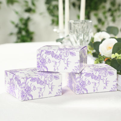 Floral printed gift boxes stacked on a table.