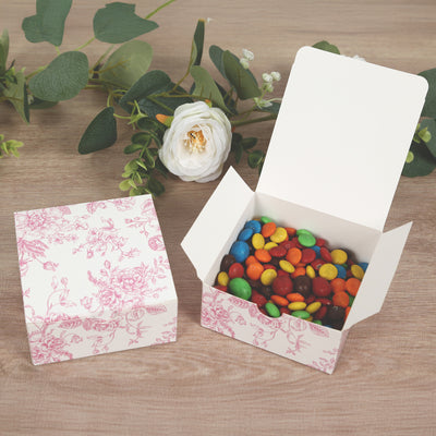 Decorative gift box filled with colorful candies and floral design.