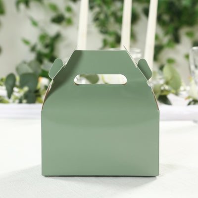 Green takeaway box with handle in a stylish setting.