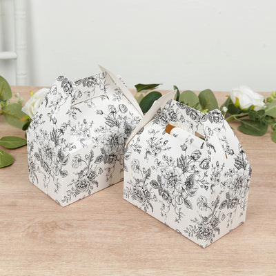 Floral printed gift boxes in two sizes on a wooden surface.