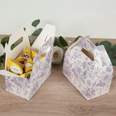 Floral-patterned gift boxes filled with candy on a wooden surface.