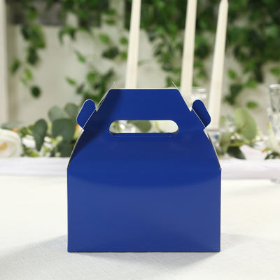 Blue gift box with handle on a table setting.