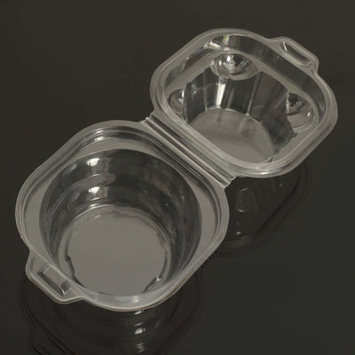 Clear plastic food container with two compartments, open view.