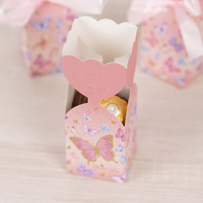 Pink butterfly-themed gift box with chocolates inside.