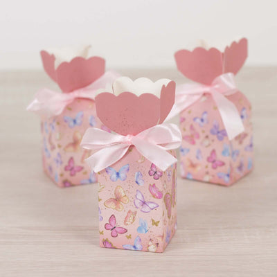 Pink butterfly-themed gift boxes with ribbon bows.